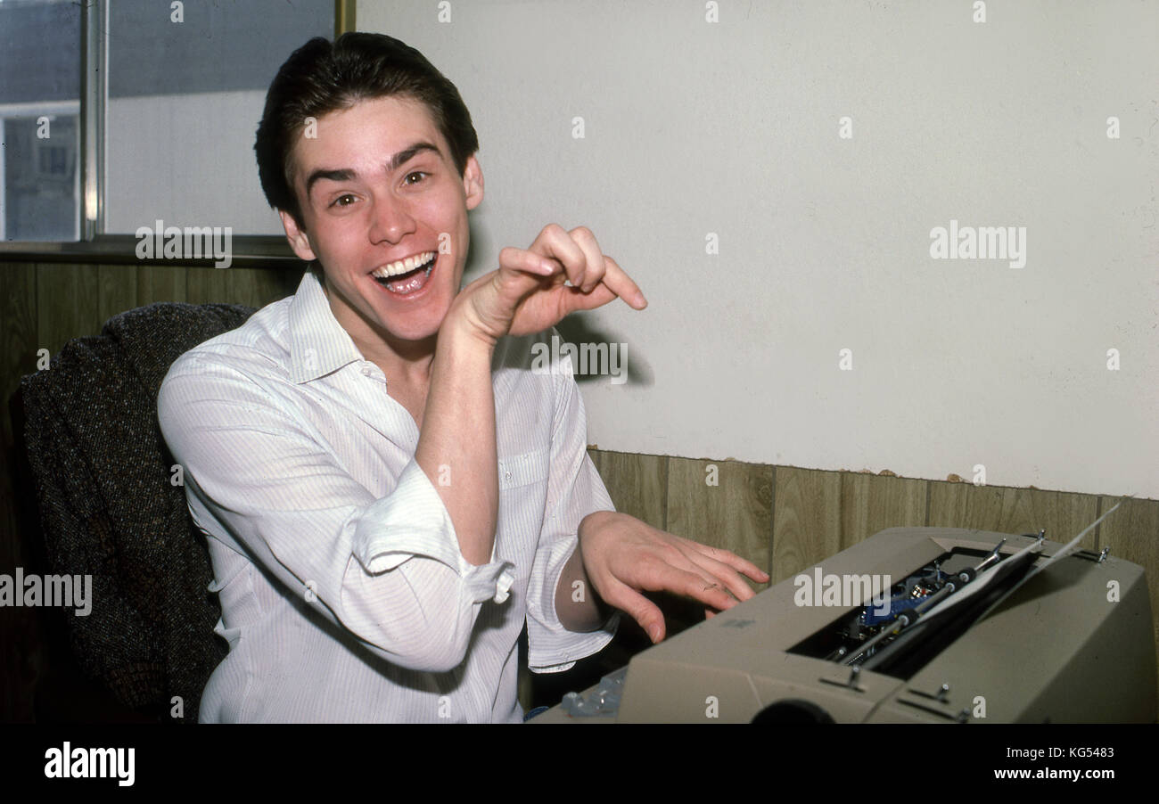 Jim Carrey goofing in office with typewriter Stock Photo