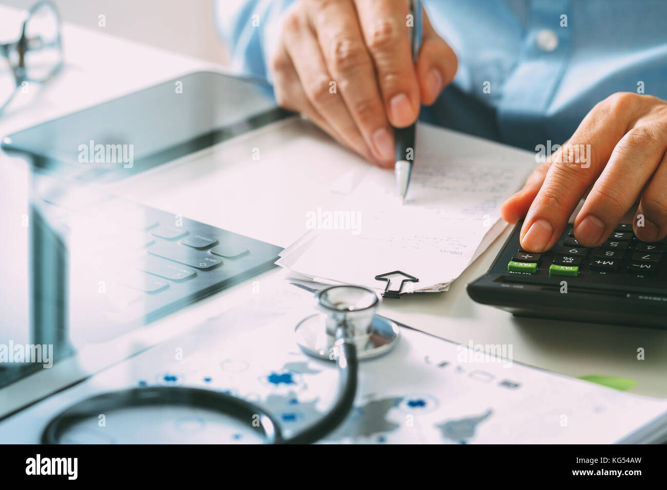 Healthcare costs and fees concept.Hand of smart doctor used a