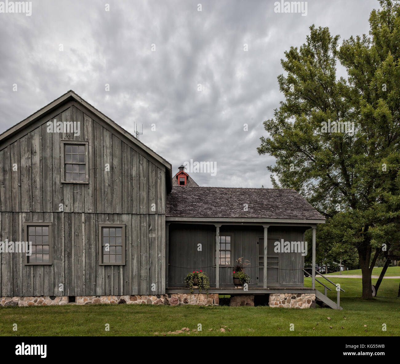 Farm house on a cloudy day Stock Photo - Alamy