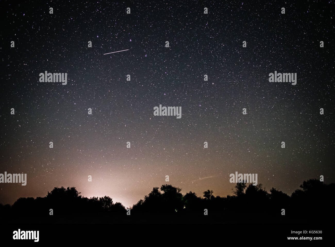 Background of bright starry night sky with lights upon on it and