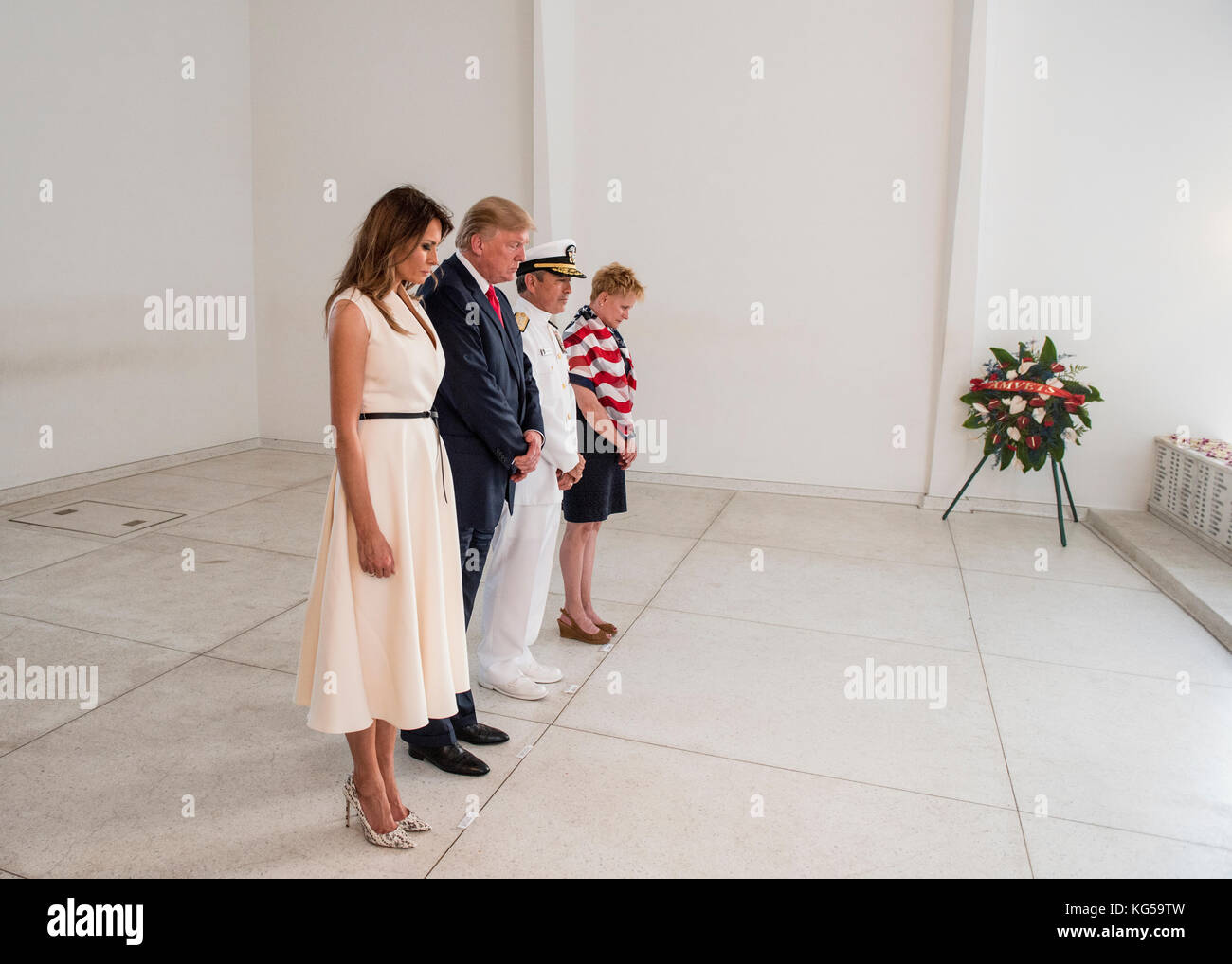First Lady Melania Trump and President Donald J. Trump as they offer flowers in honor of fallen service members at the USS Arizona Memorial. Stock Photo