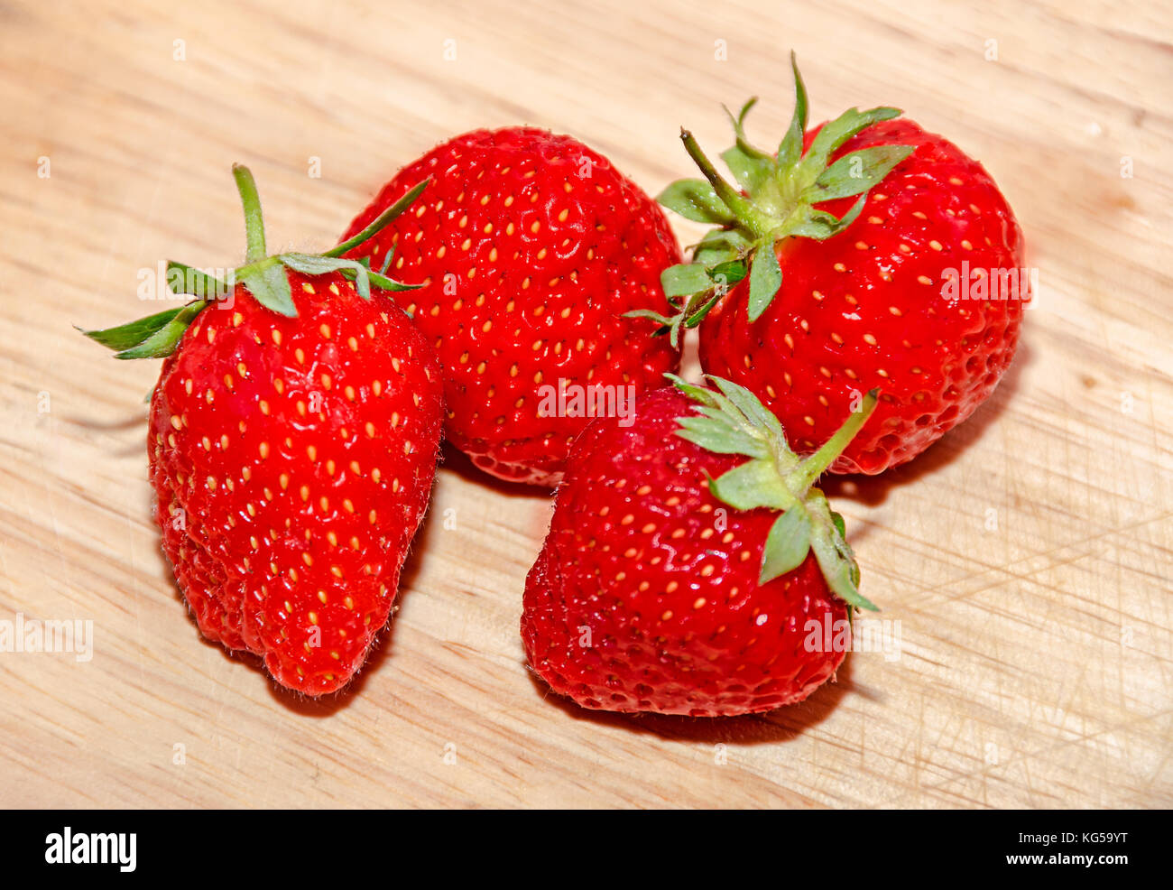 Red strawberries fruits, rustic wood background, close up Stock Photo ...