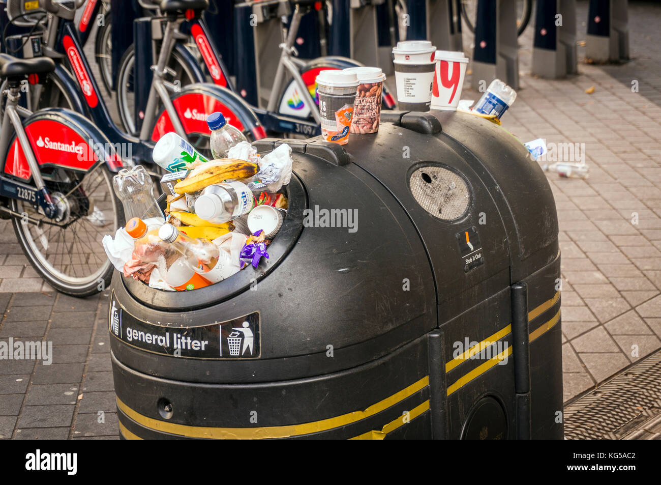 Overflowing litter bin in Kensington, London, UK Stock Photo