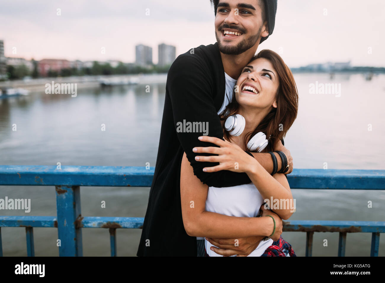 Portrait of attractive loving couple on bridge Stock Photo - Alamy