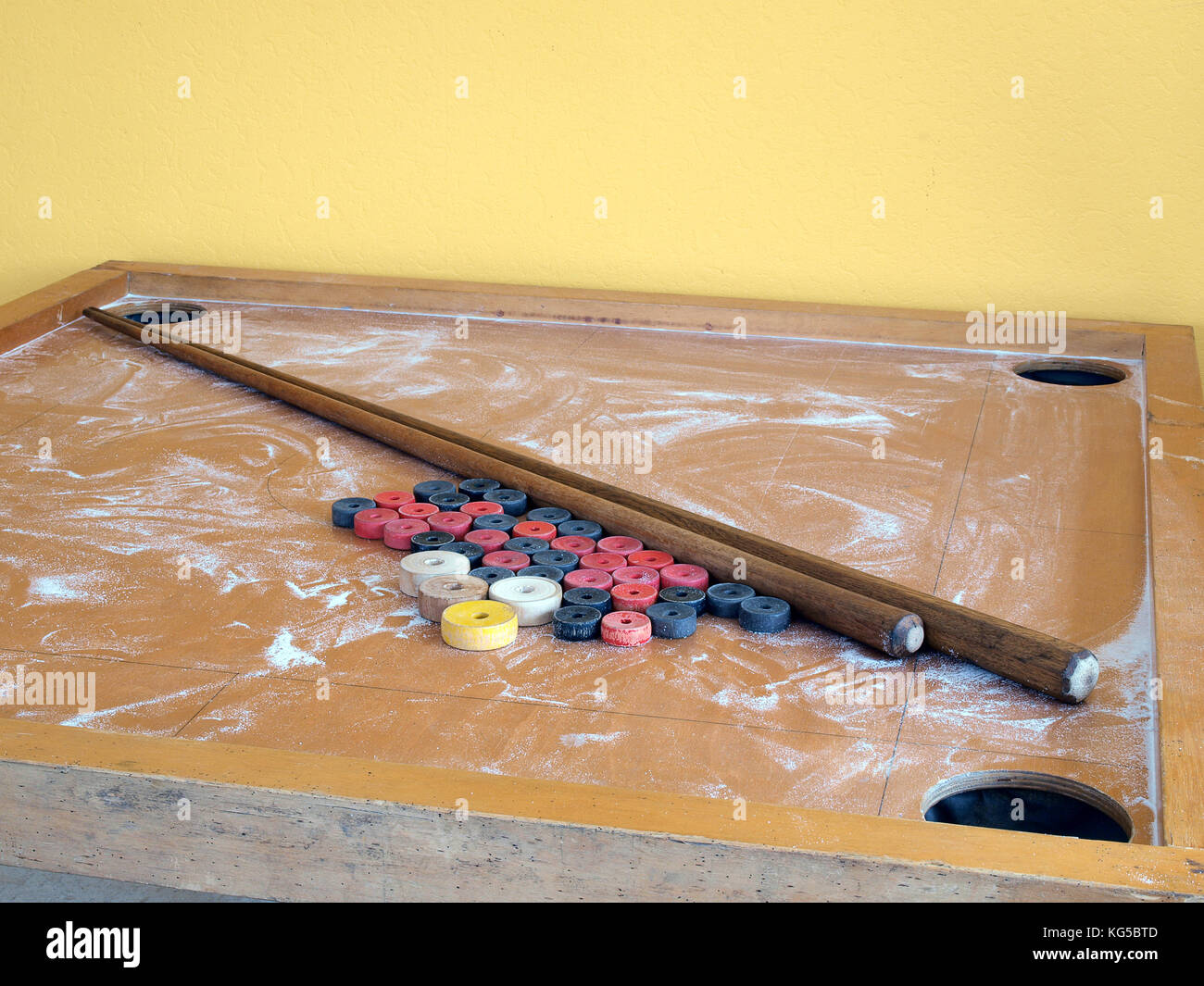 Novuss game table with bones and cues dusted with boric acid powder Stock Photo