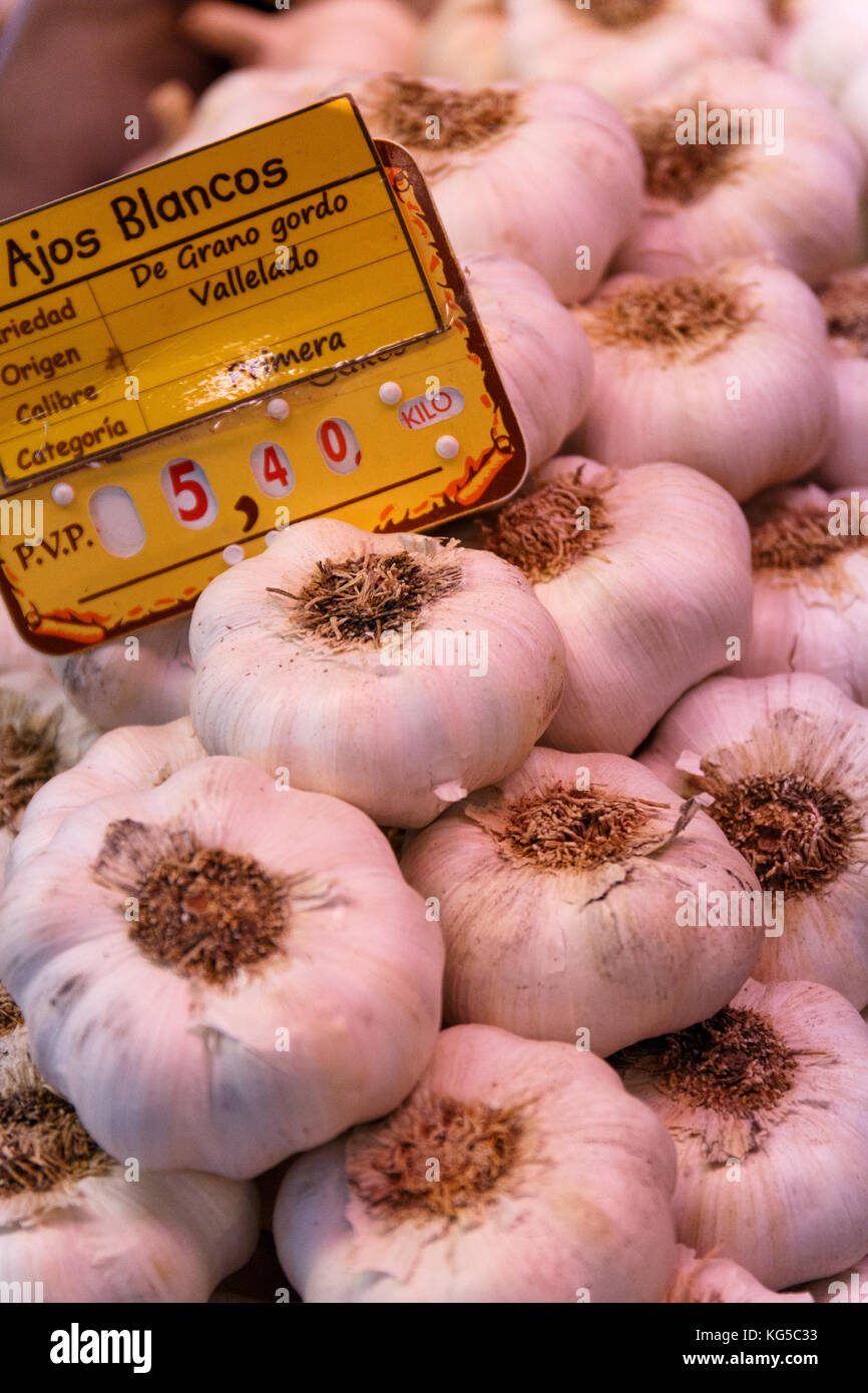 white and large garlic at a market stall in madrid Stock Photo
