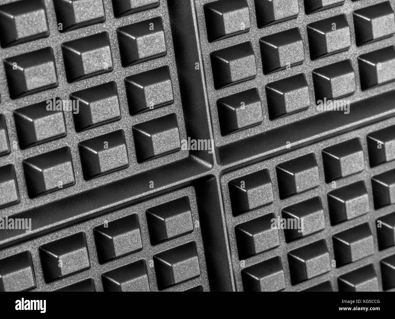 A close up shot of a waffle iron selectiv focus Stock Photo