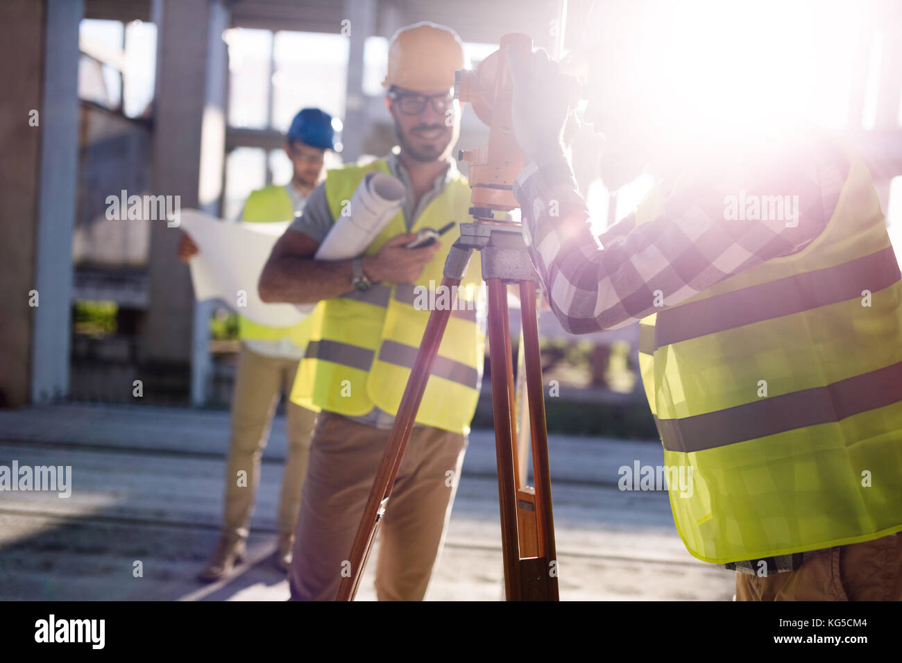 Portrait of construction engineers working on building site Stock Photo