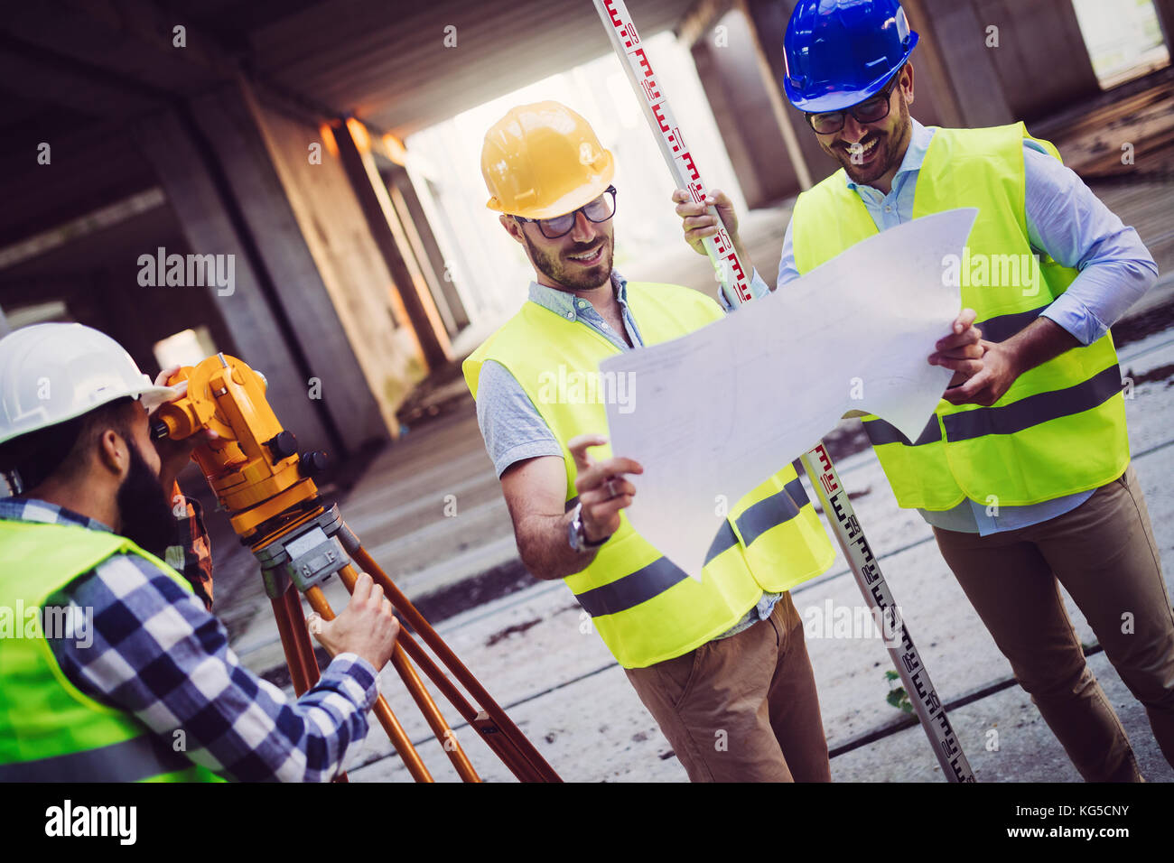 Portrait of construction engineers working on building site Stock Photo ...