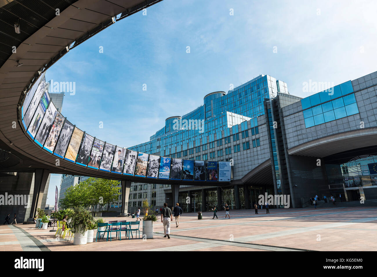 Brussels, Belgium - August 28, 2017: Facade of the modern office buildings of the European Parliament and station Europe with people around in Brussel Stock Photo