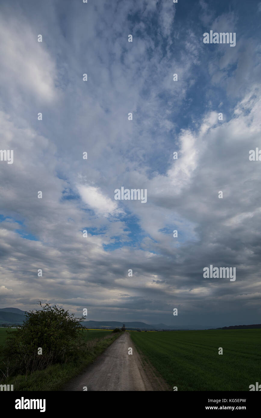 Dark dramatic landscape stormy sky over field Stock Photo - Alamy