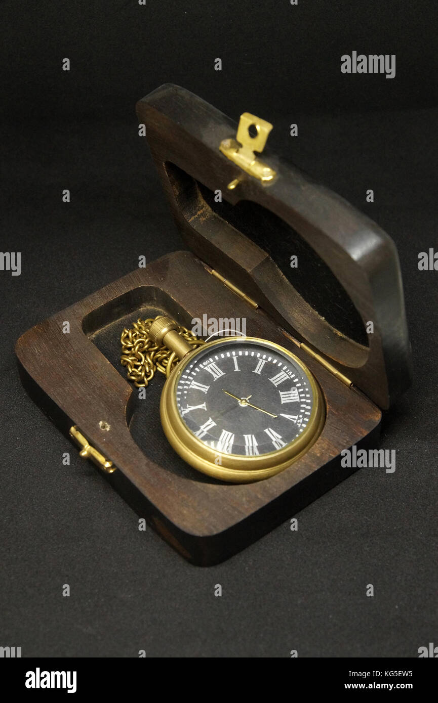 Antique old wrist watch in wood box.Isolated on black background Stock ...