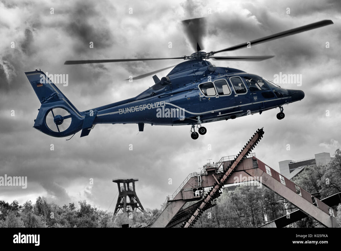 Transport helicopter EC 155 B of the federal police while take-off on Zollverein Coal Mine Industrial Complex, Essen, North Rhine-Westphalia, Germany [M] Stock Photo