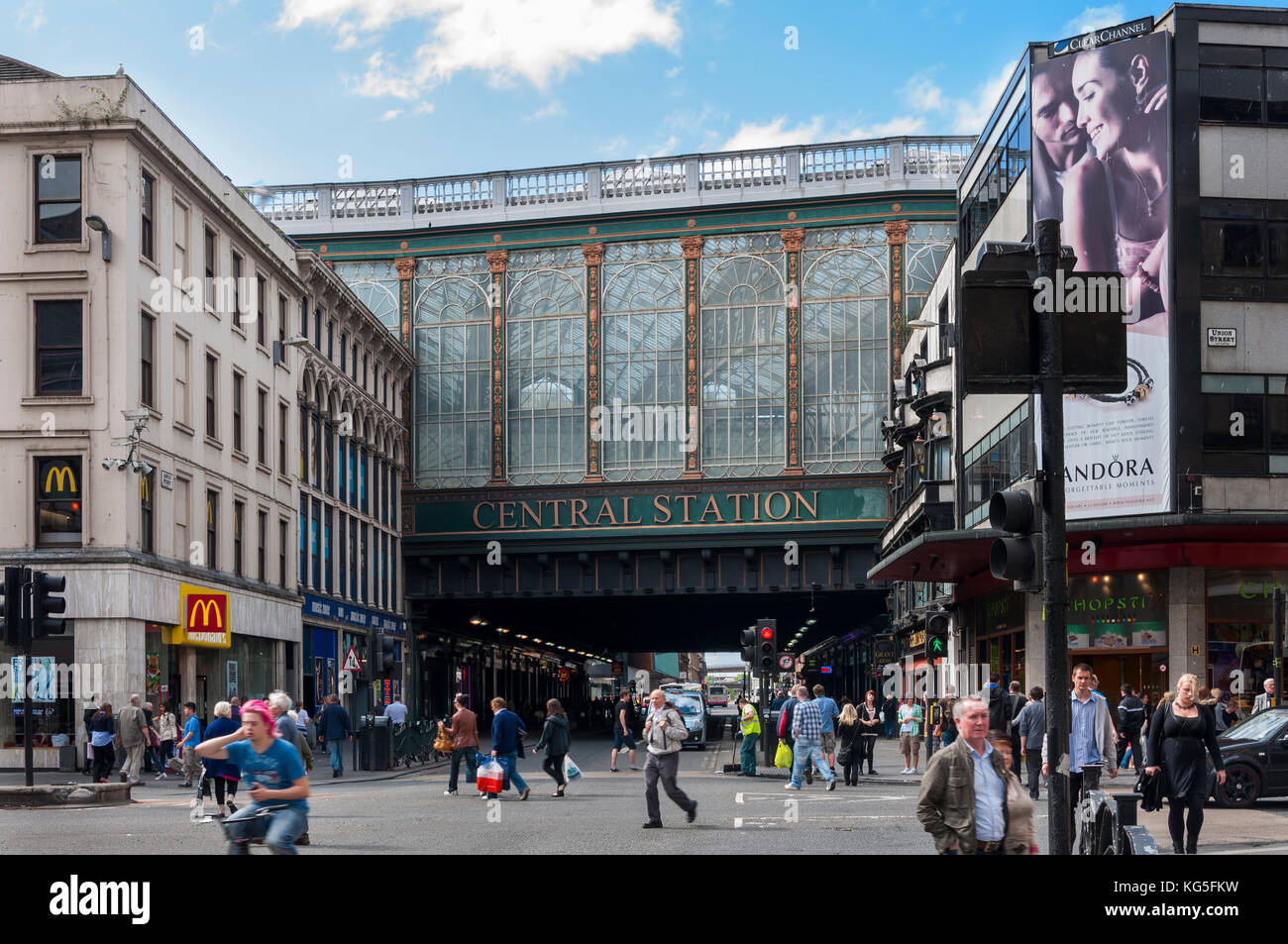 Glasgow, Scotland - August 17, 2010: The exterior of the Glasgow Central Station with people in a busy street in the city of Glasgow, Scotland, United Stock Photo