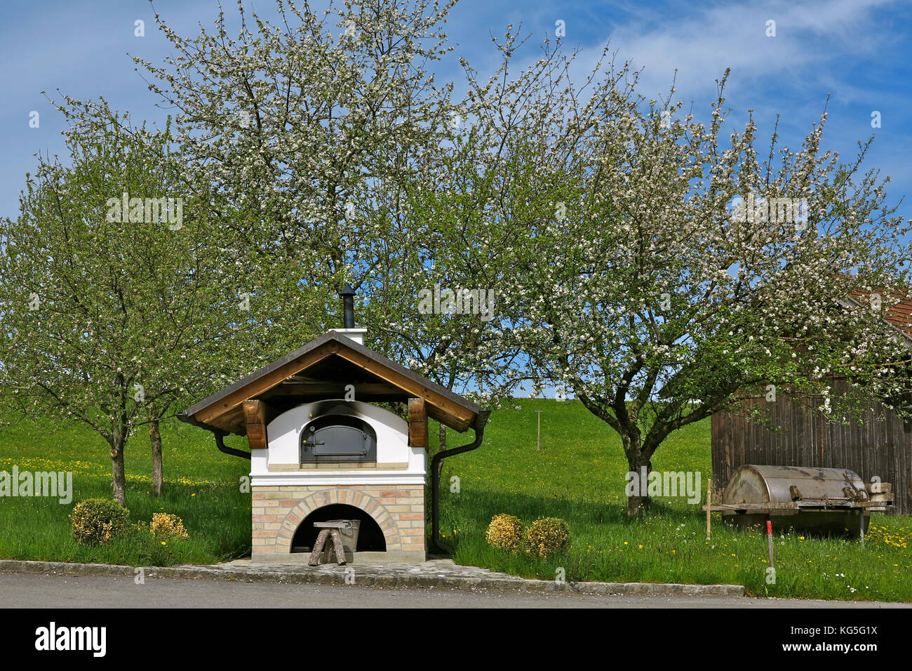Germany, Bavaria, Froschhausen am Riegsee (lake), bake house, fruit trees, flowering, spring Stock Photo
