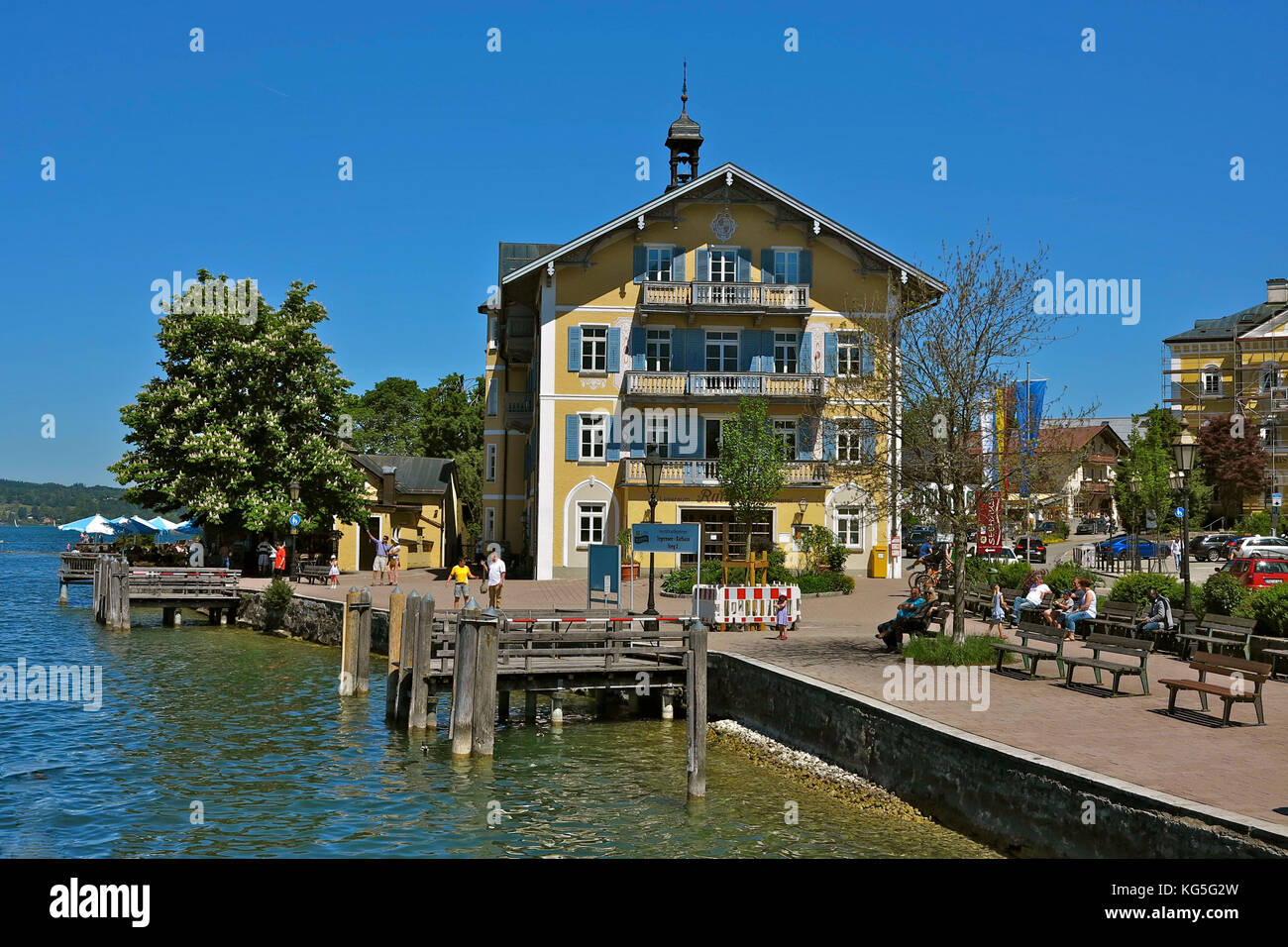 Germany, Bavaria, Tegernsee, seen from the ship, pier for round trips, town hall Tegernsee, benches, people, Stock Photo