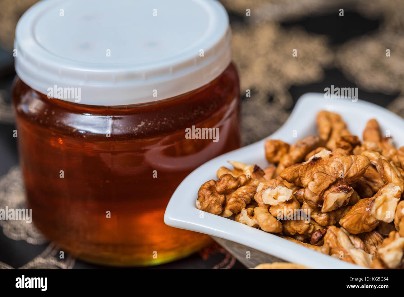 Sweet honey and walnuts for breakfast. Sweet nuts Stock Photo Alamy