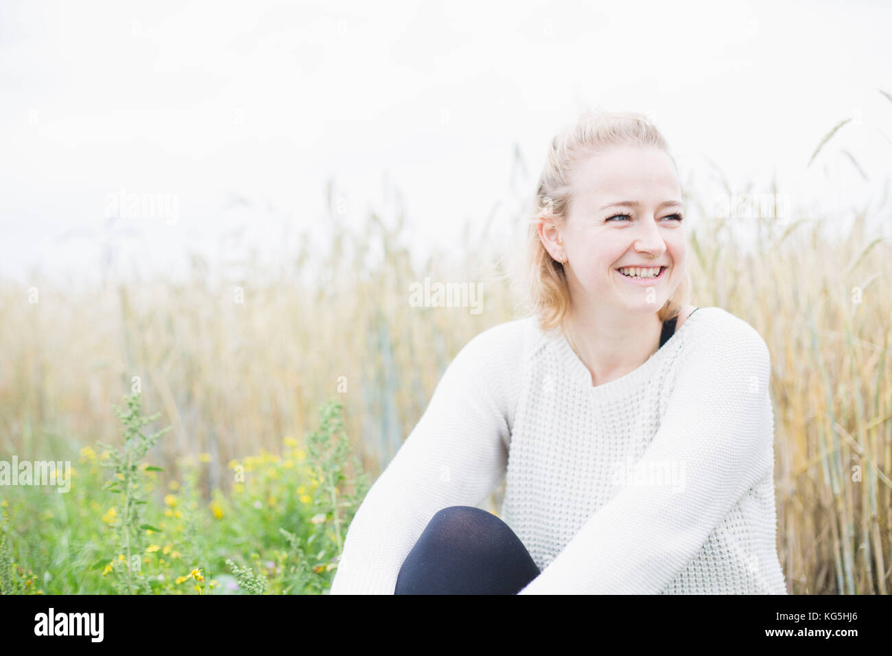 young woman smiling in nature Stock Photo - Alamy