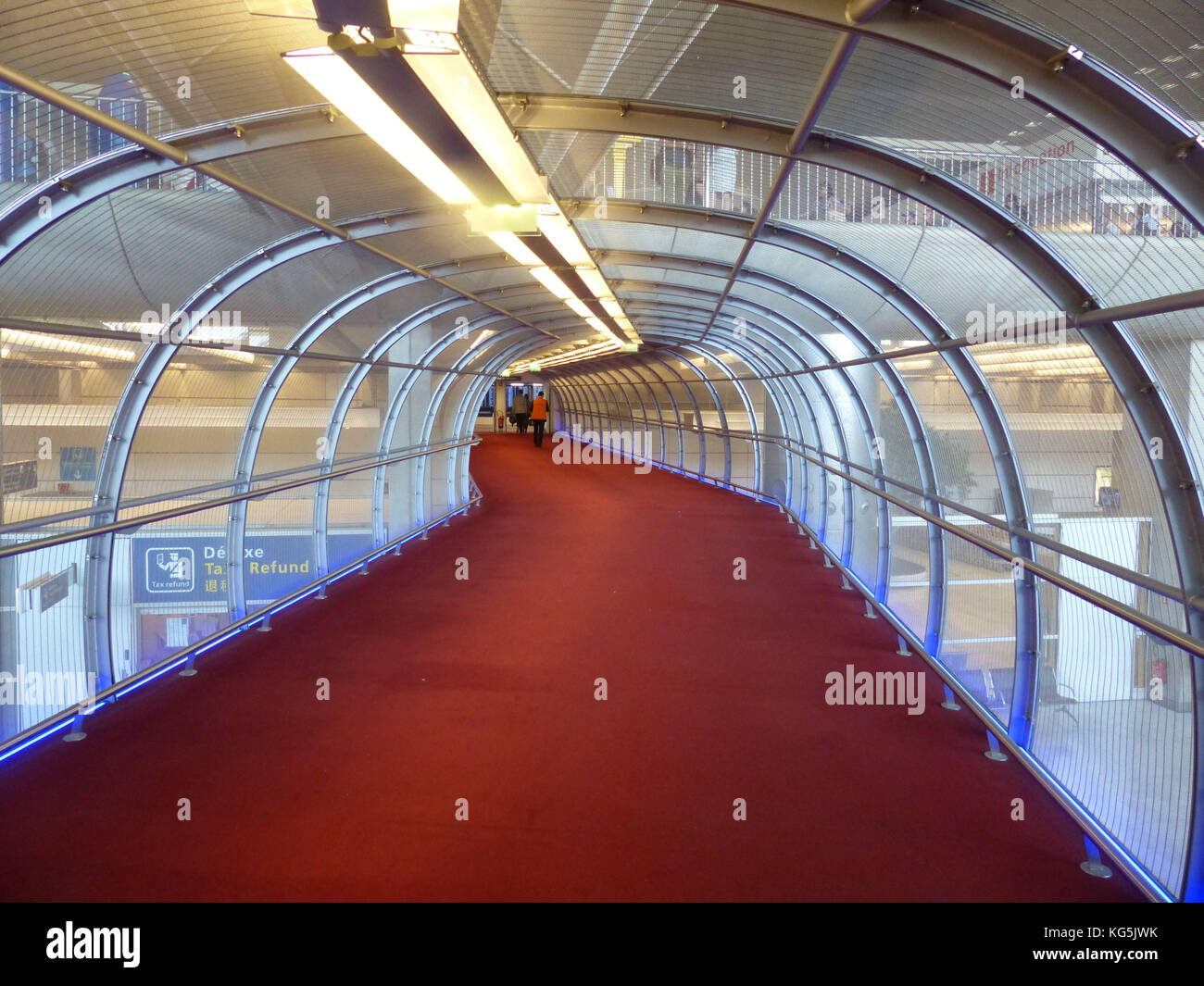 Red carpeted skywalk at Charles de Gaulle International Airport Stock Photo