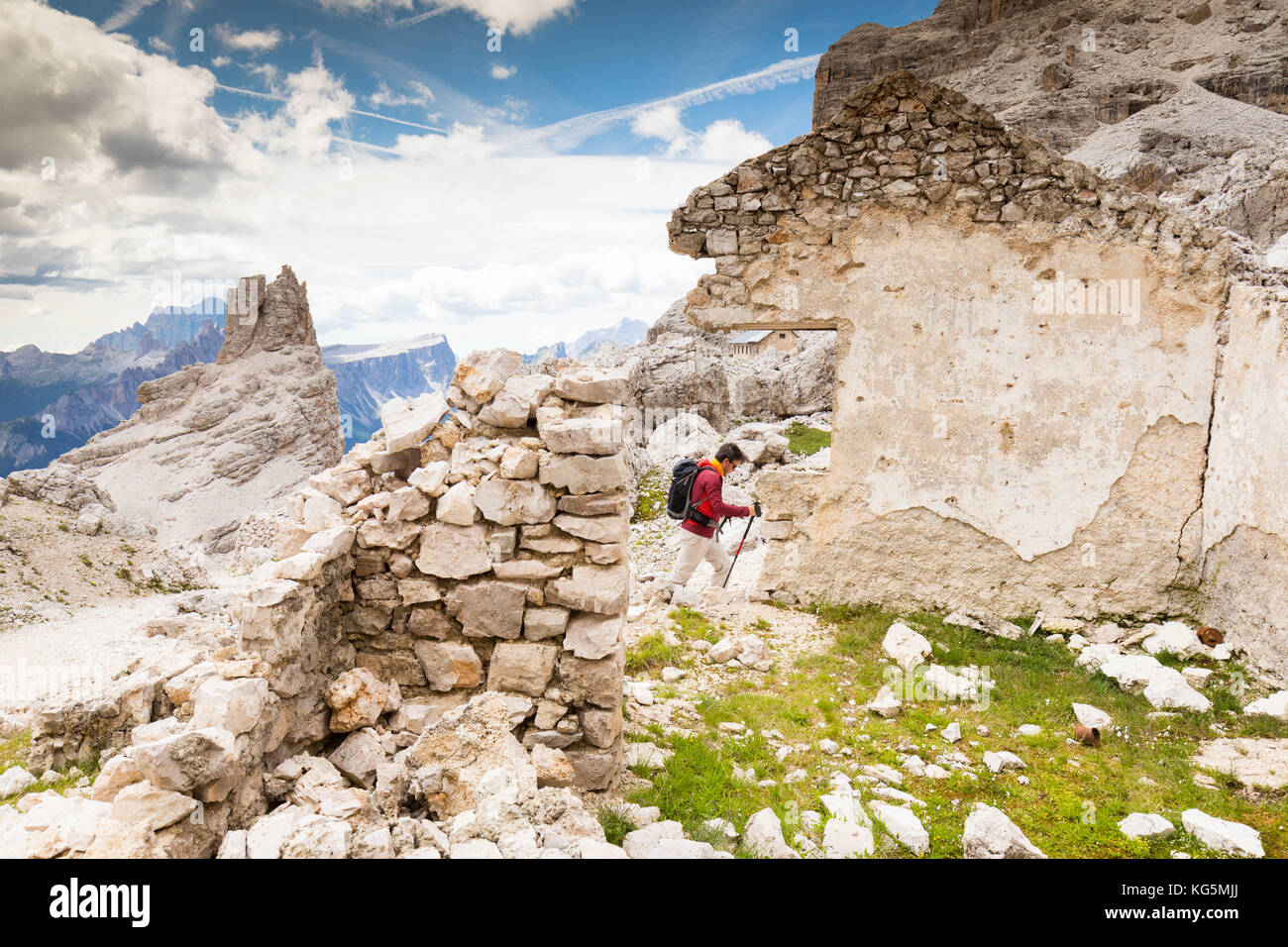 a hiker is walking on the Tofana di Rozes through the ruins of the World War I, Belluno province, Veneto Stock Photo
