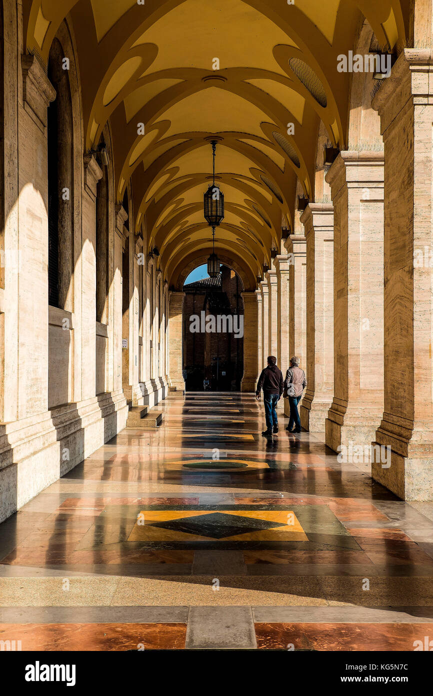 Forlì, Emilia Romagna, Italy, Europe. Passersby walking through the Poste column gallery. Stock Photo
