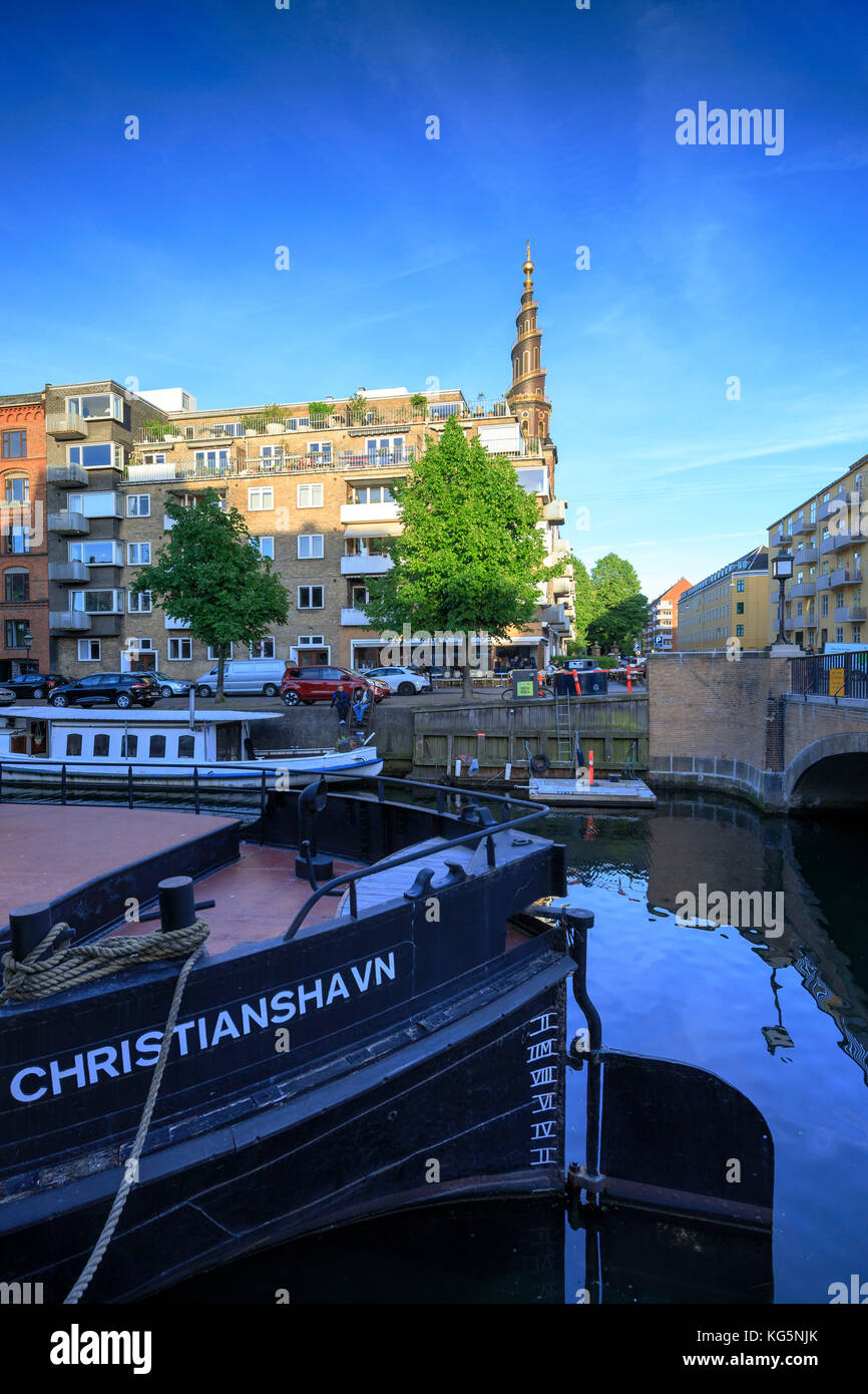 Boats and tourist ferry moored in Christianshavn Canal, Copenhagen, Denmark Stock Photo