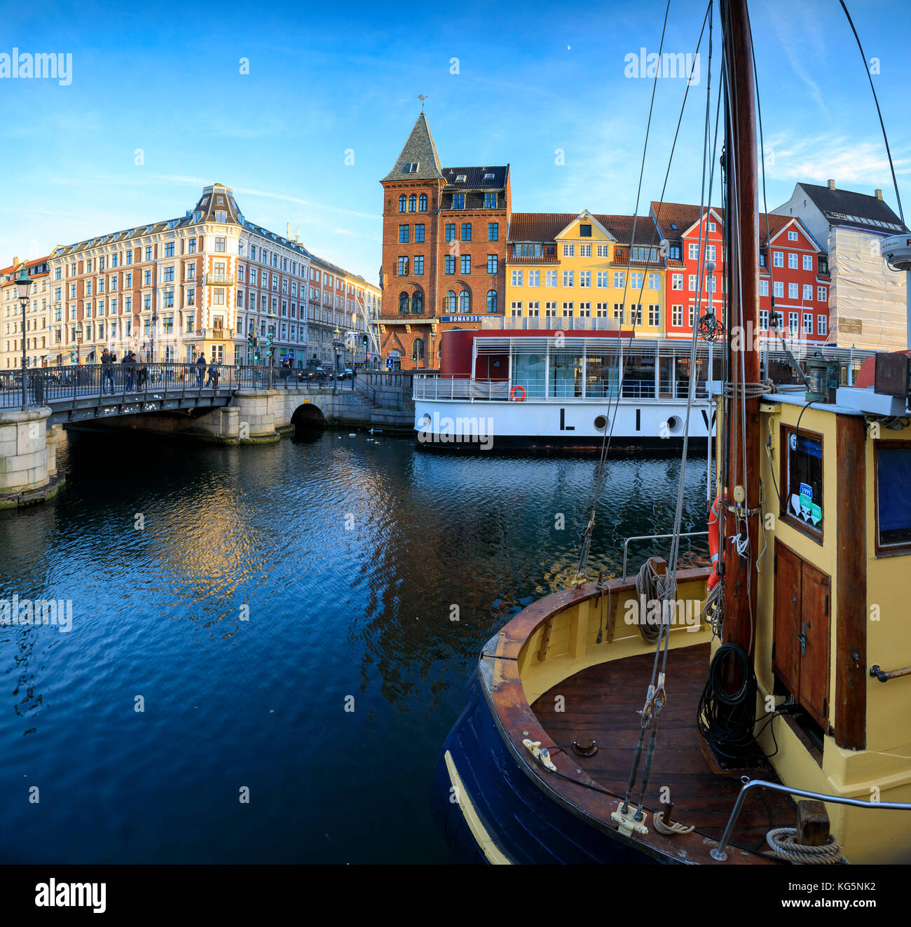 Panoramic of Christianshavn Canal and colorful houses on the background, Copenhagen, Denmark Stock Photo