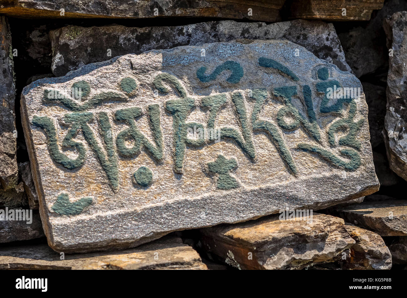 Buddhist prayers carved in stone, Rasuwa district, Bagmati region, Nepal, Asia Stock Photo