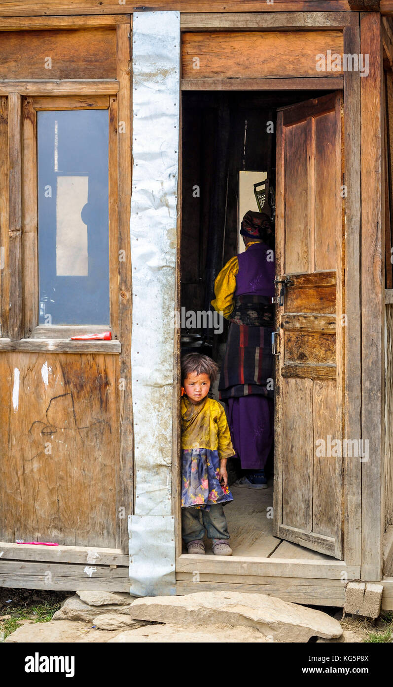 Curious baby on the doorstep, Rasuwa district, Bagmati region, Nepal, Asia Stock Photo