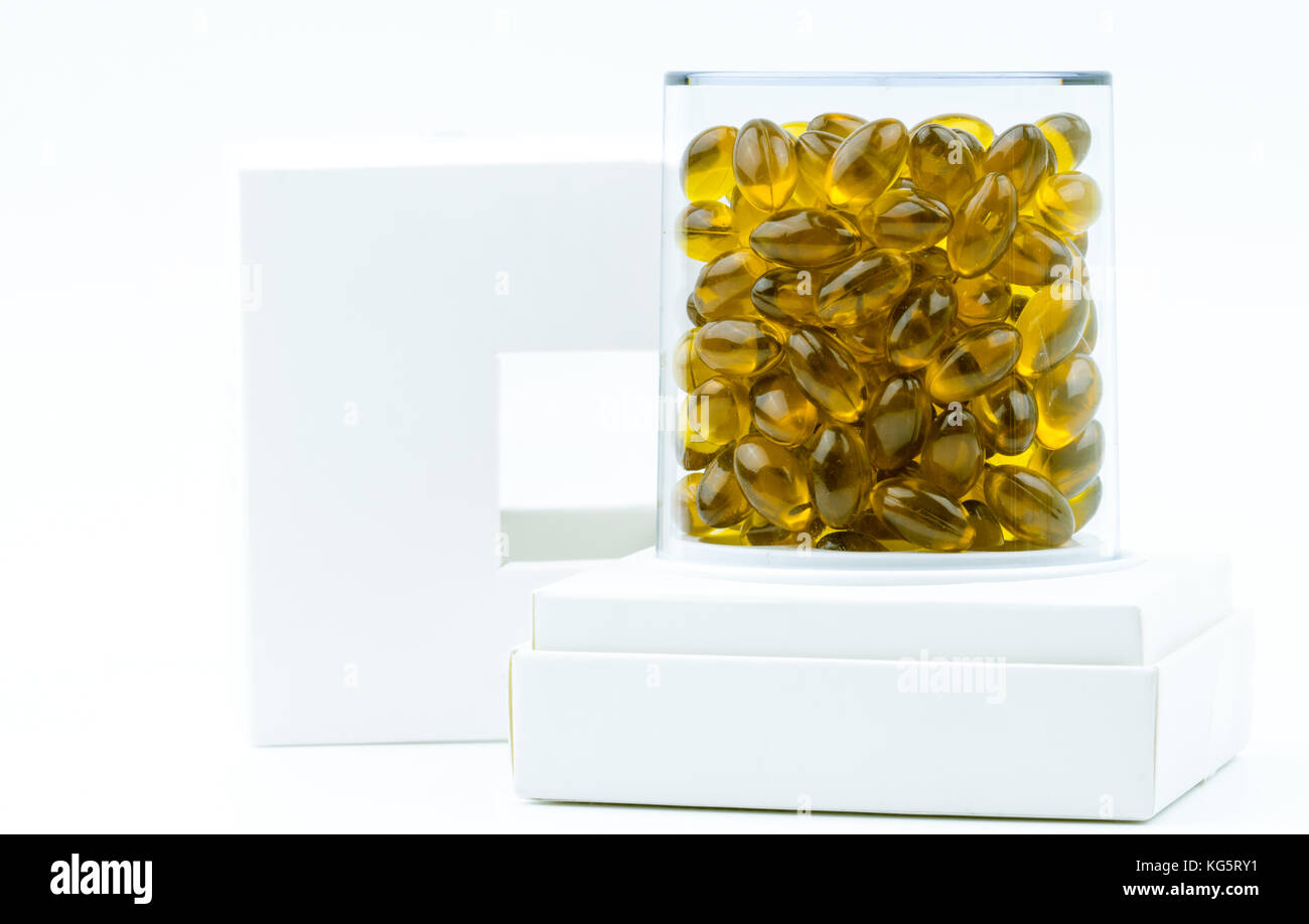 Rice bran oil extract capsule in luxury plastic box packaging isolated on white background Stock Photo