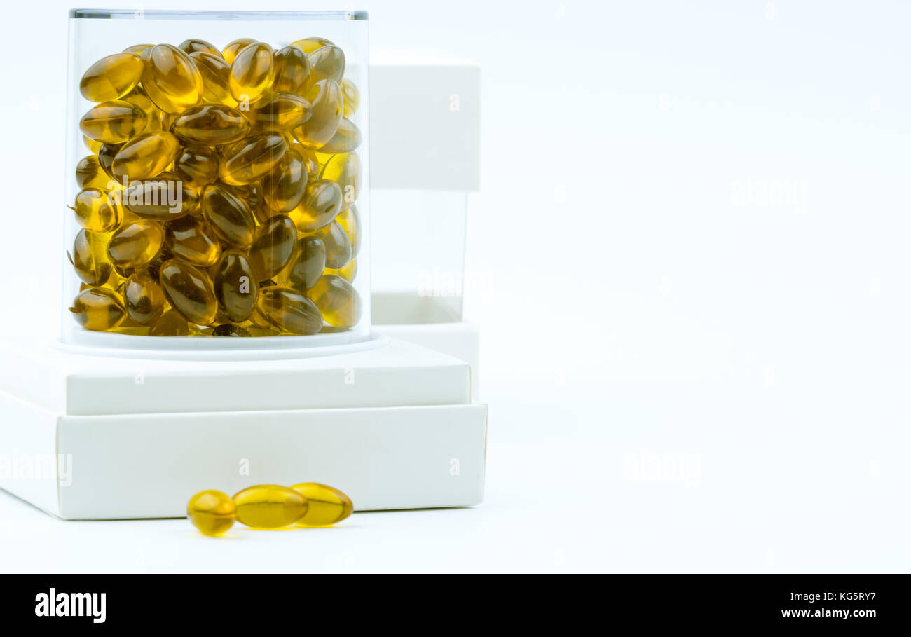 Rice bran oil extract capsule in luxury plastic box packaging on white background Stock Photo