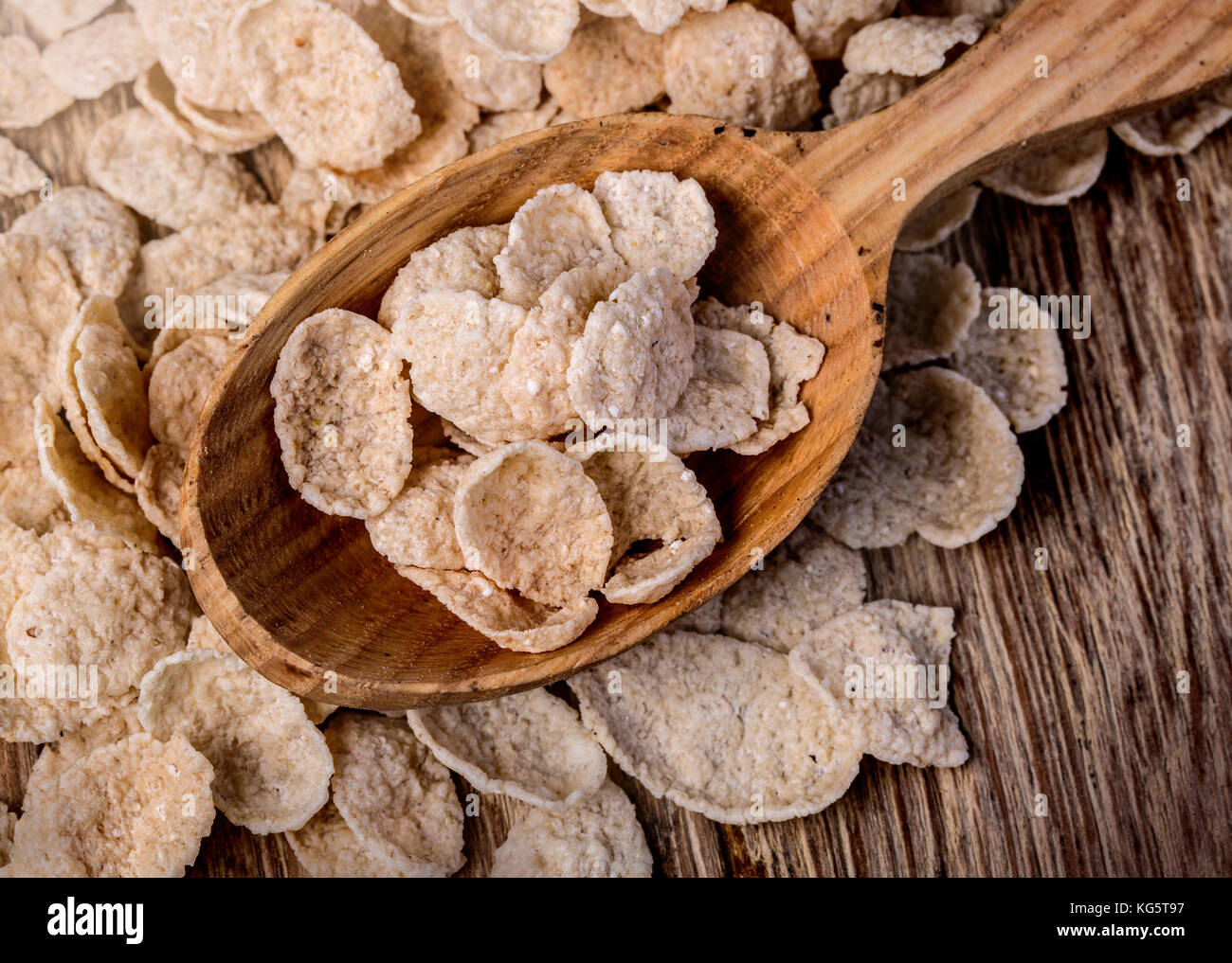 Oat ears of grain on a wooden table, oatmeal. Stock Photo