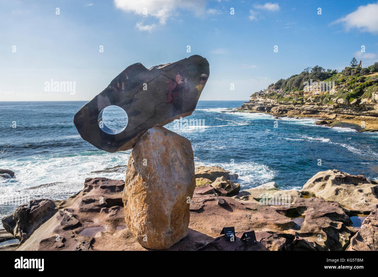 Sculpture by the sea 2017, annual exhibition on the coastal walk between Bondi and Tamara Beach, Sydney, New South Wales, Australia. Basalt sculpture  Stock Photo