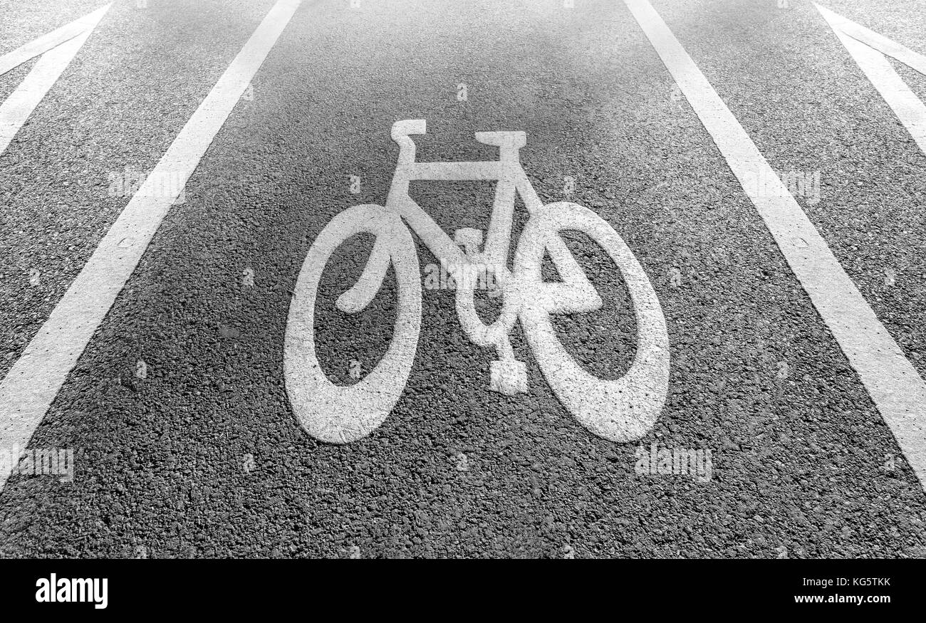 Bicycle lane signage on street black and white background Stock Photo