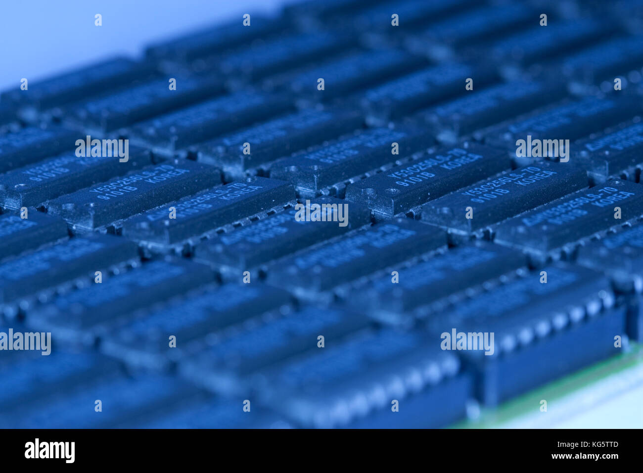 computer mainboard - dual inline modules, surface mounted devices with green, red, blue light - macro shot Stock Photo