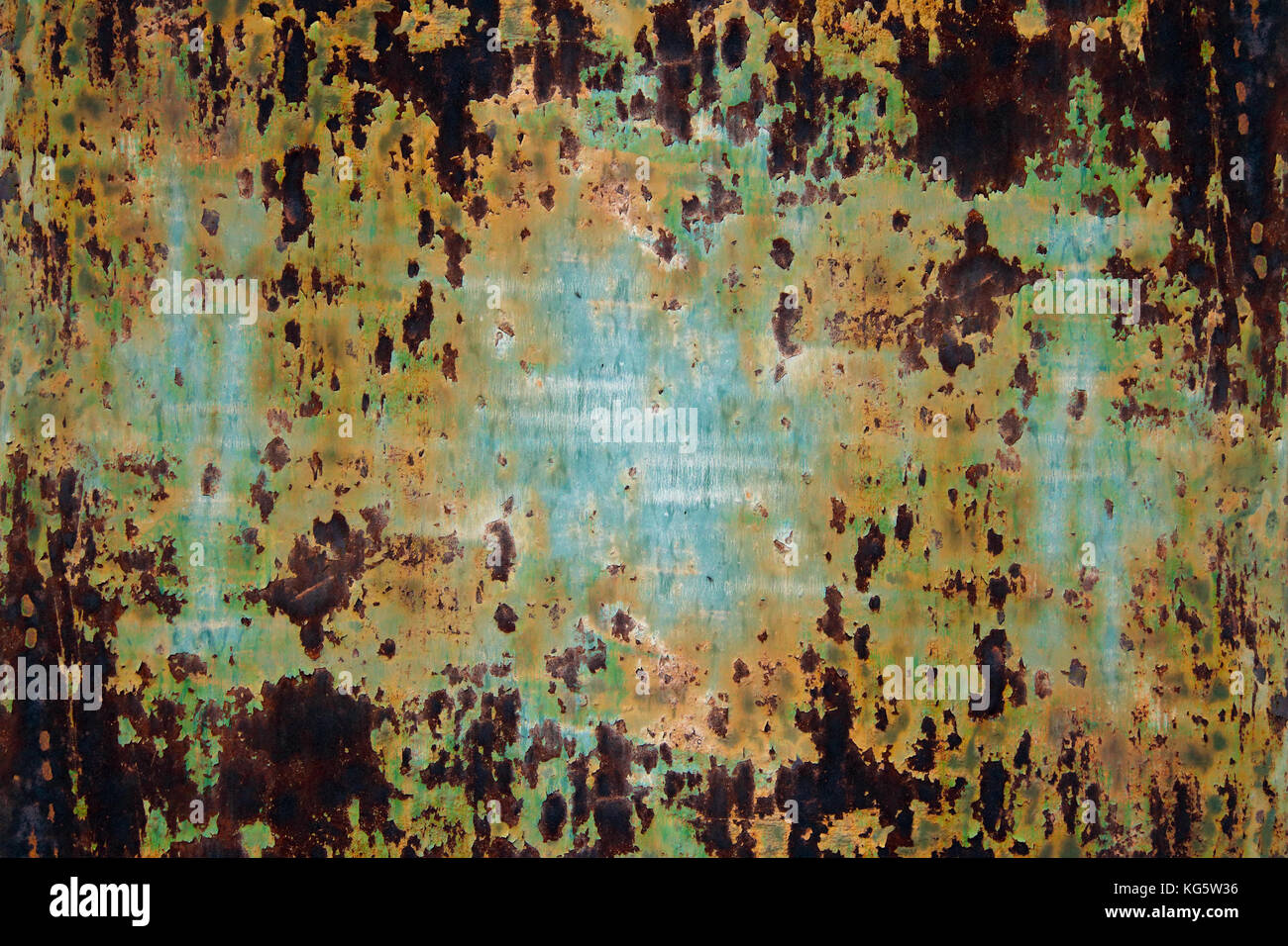 Flaking paint from the rusty metal surface Stock Photo