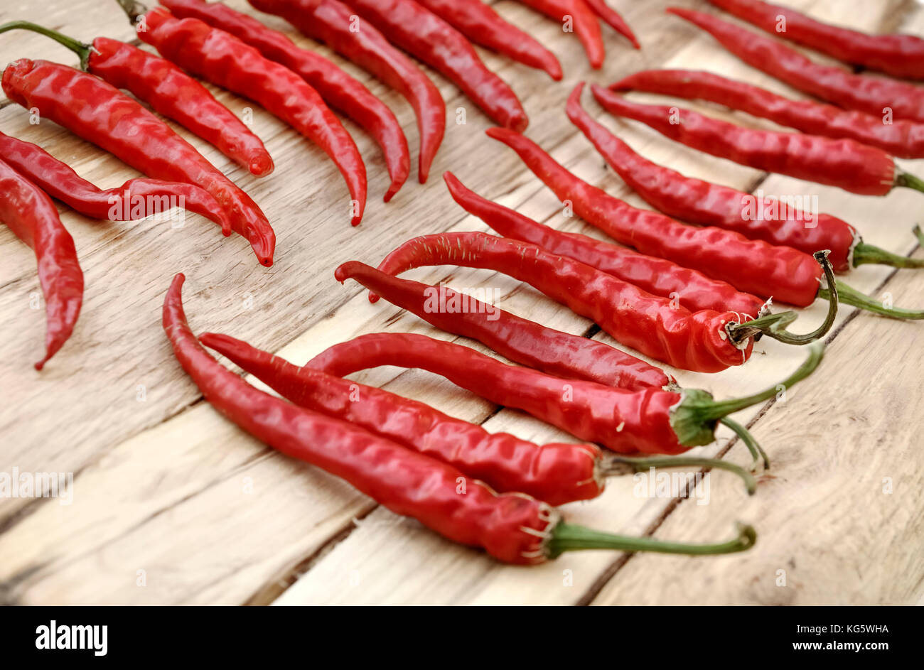 red hot chili peppers drying on wooden background Stock Photo Alamy