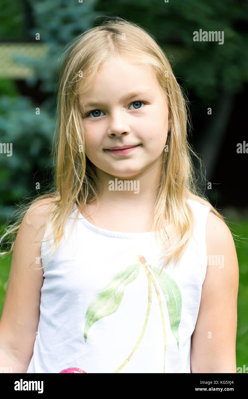 Cute girl with blond long hair and blue eyes Stock Photo - Alamy