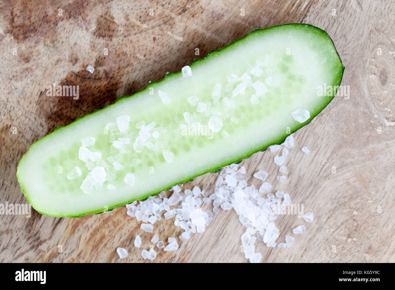 salt on half a cucumber Stock Photo Alamy
