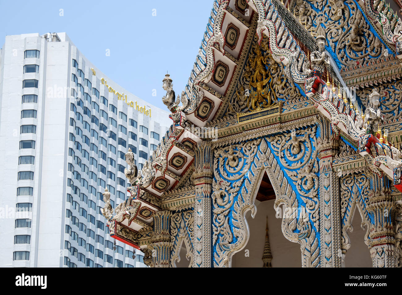 Old-new juxtaposition of architectural styles between Wat Suan Phlu temple and Shangri-la Hotel in backdrop, Bang Rak District, Bangkok, Thailand. Stock Photo