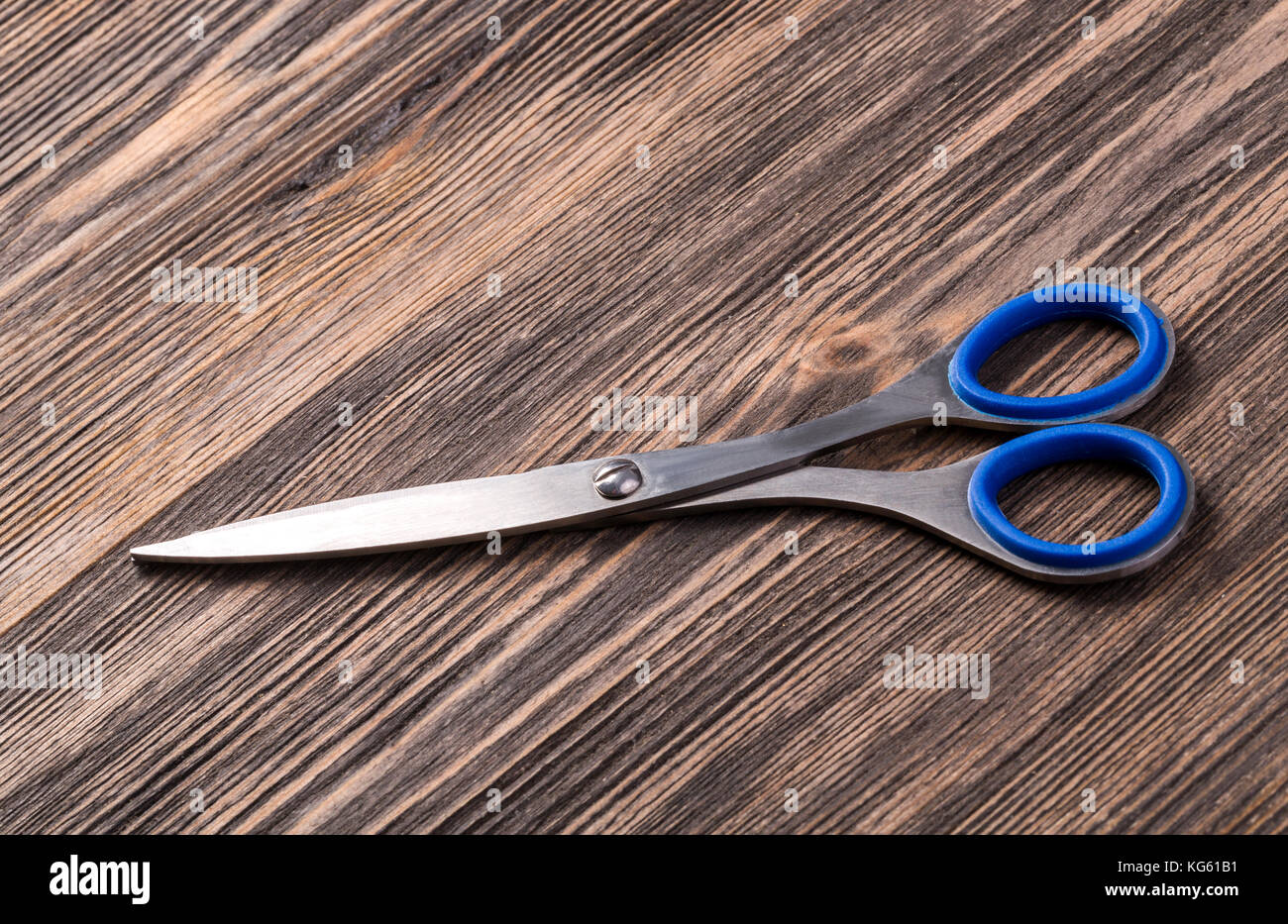 scissor on wooden board background for your design Stock Photo Alamy