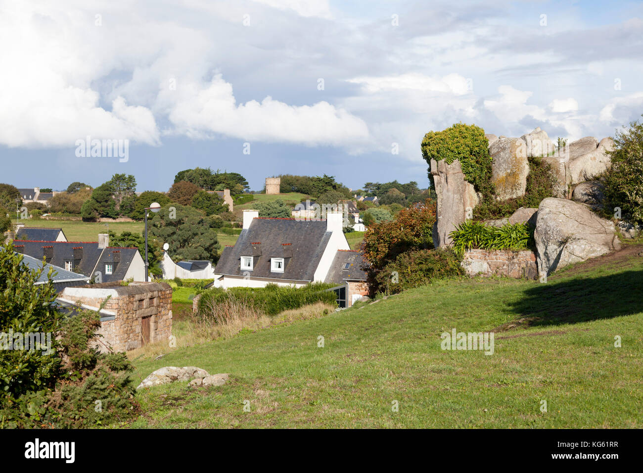 A view on houses of Brehat island (Brittany). If the Brehat housing lacks unity it uses plentifully a quality local material: the pink granite. Stock Photo