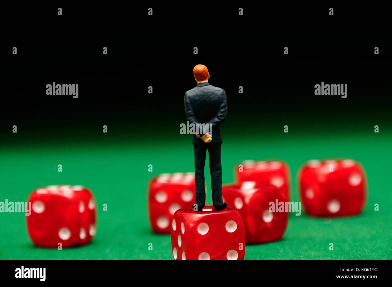 businessman figurine standing on dice, leadership decisions concept Stock Photo