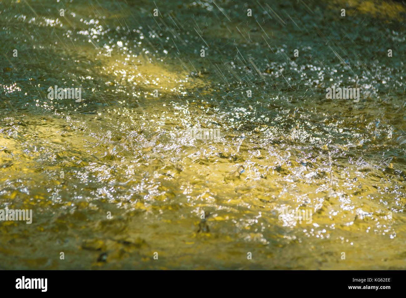 Many Drops Many Ripples Abstract photo of water surface with ripple and many falling drops ...