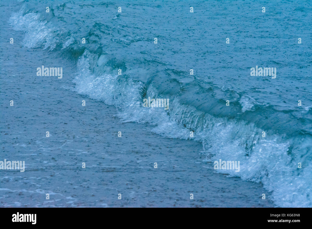 large raindrops falling on the sea during a strong thunderstorm on the Mediterranean Sea Stock Photo