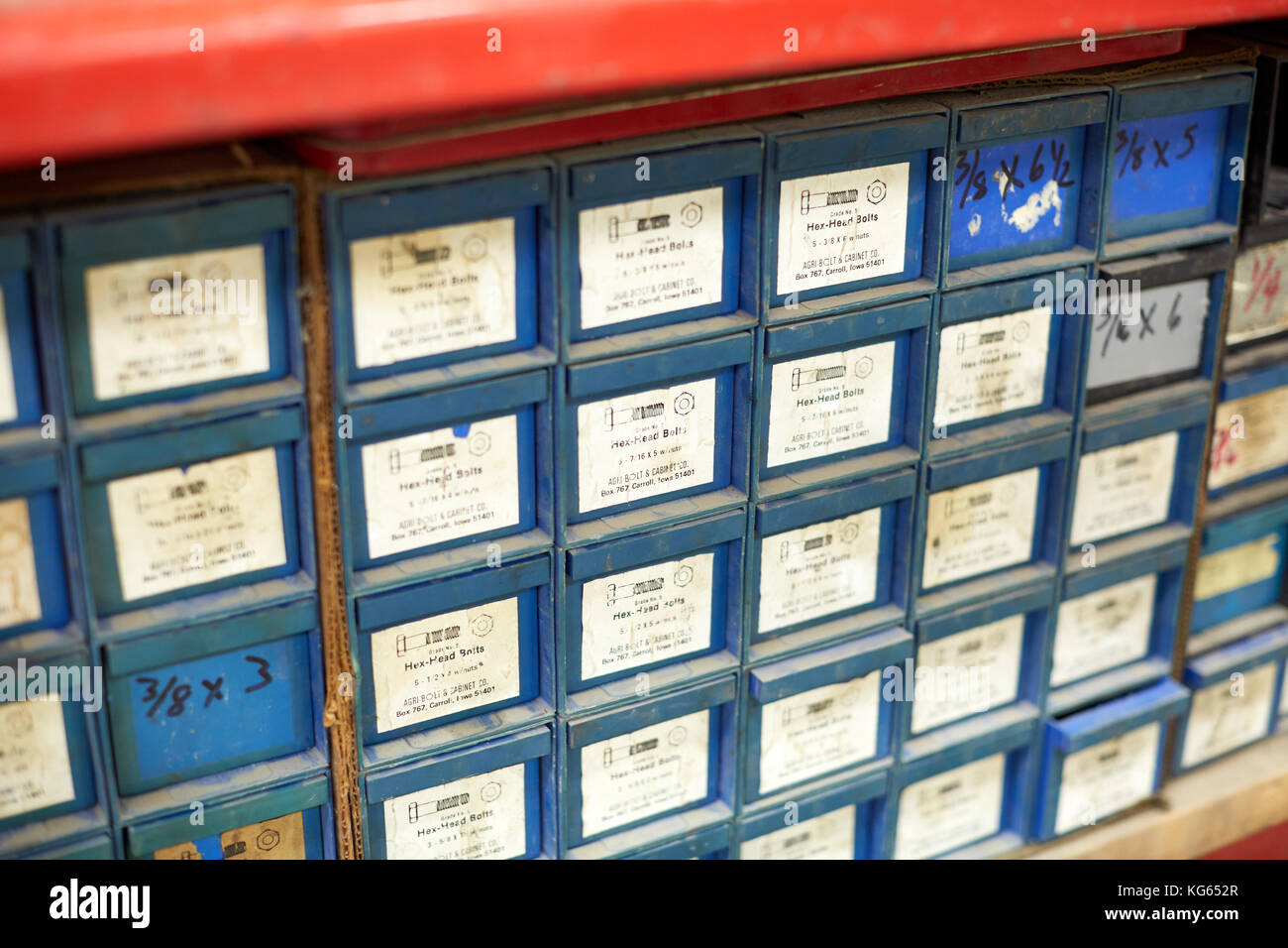 Storage Cabinet With Lots Of Small Drawers With Text Labels In An