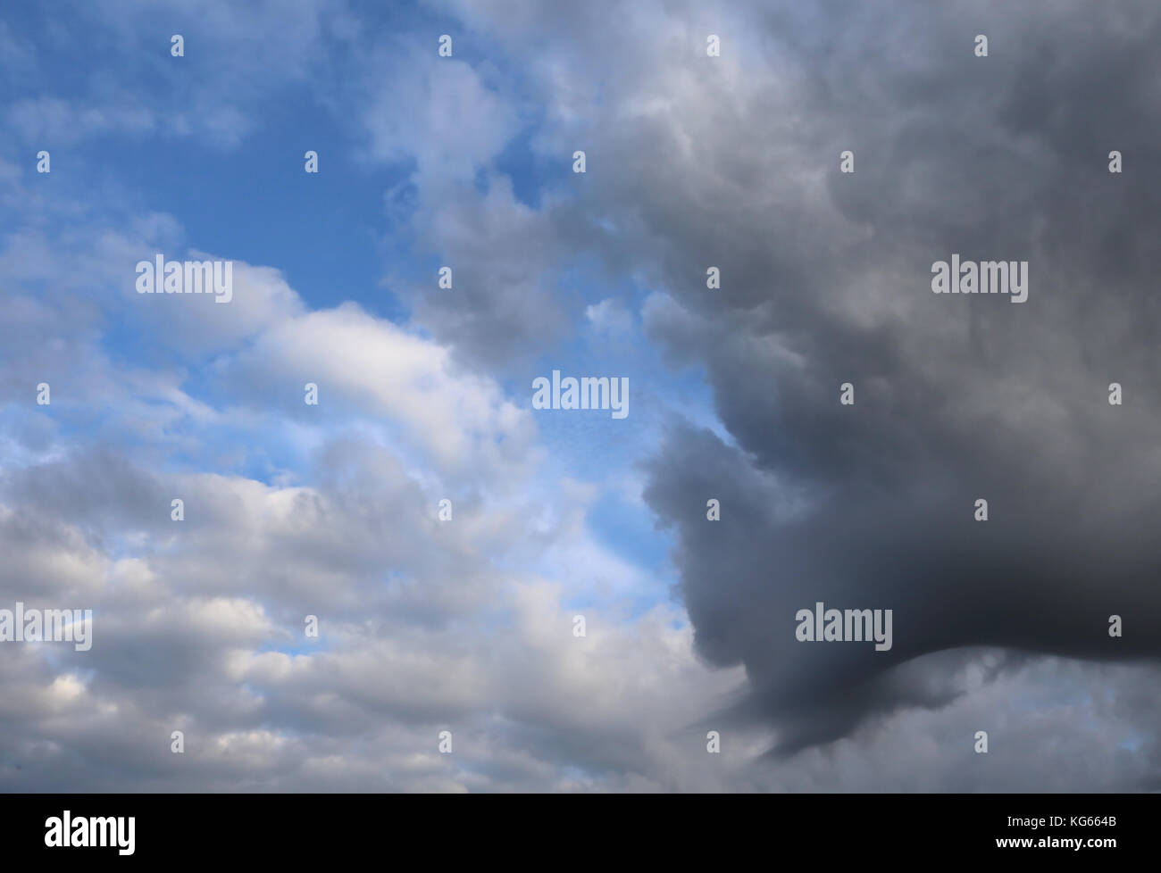 awesome blue sky with black and white clouds Stock Photo - Alamy