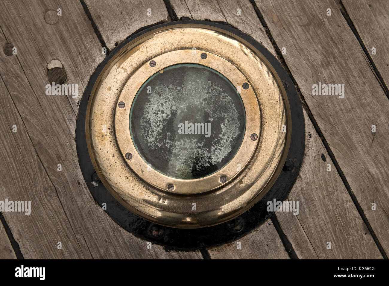 Porthole of a sailing ship with a wooden surround Stock Photo - Alamy