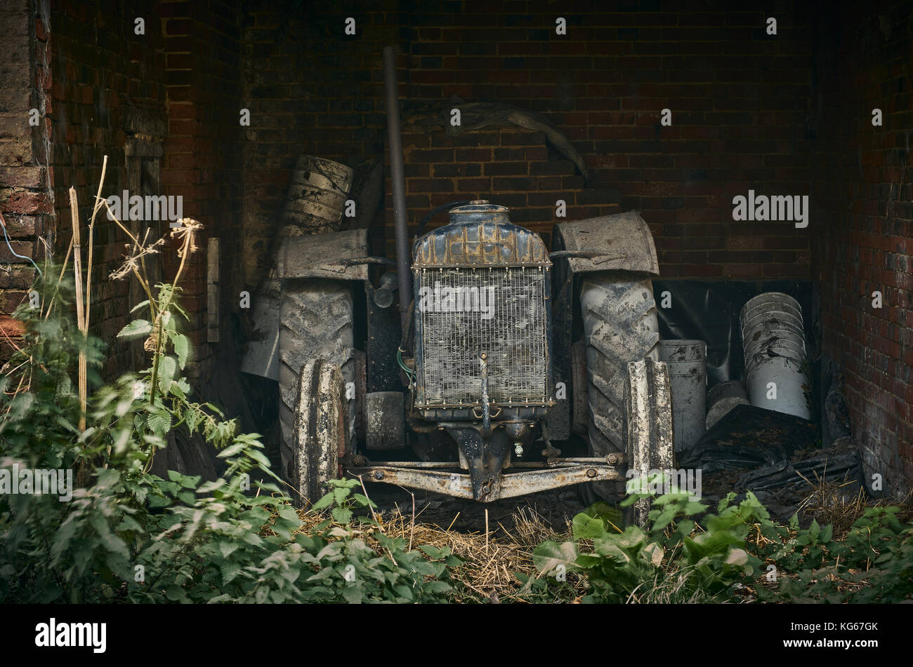 Old farming equipment brick barn hi-res stock photography and images ...