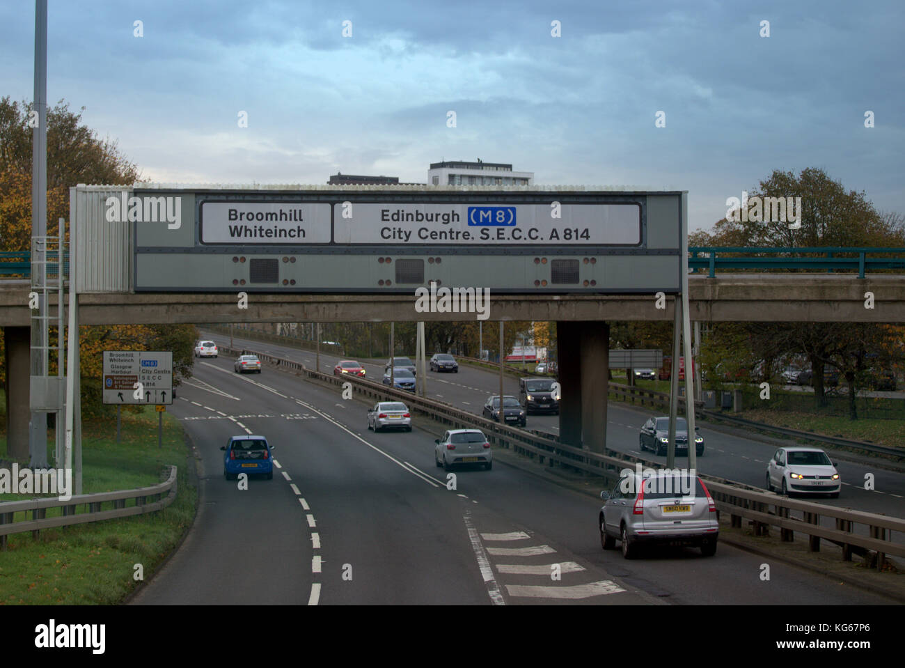 A82 M8 overhead sign  fast link lanes traffic fast flowing city centre Stock Photo